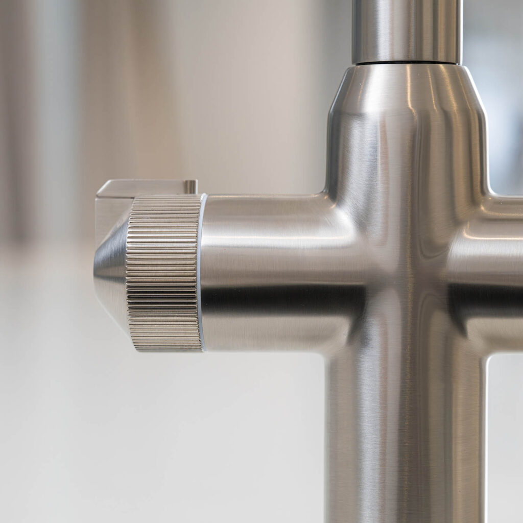 Quel Ultra Plus 4-in-1 instant boiling water tap in brushed nickel, close-up of the textured multifunction control on the tap body.