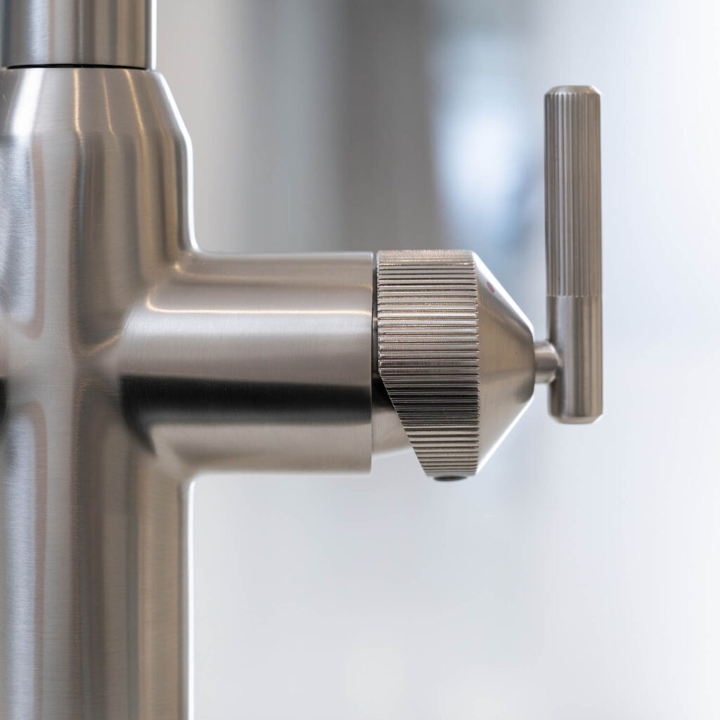 Quel Ultra Plus 4-in-1 instant boiling water tap in brushed nickel, close-up of the textured hot and cold water control lever.